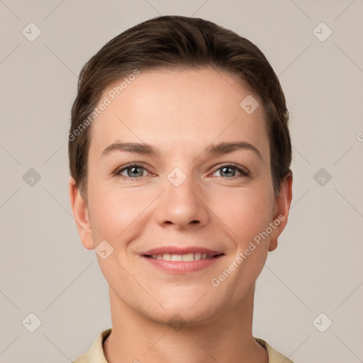 Joyful white young-adult female with short  brown hair and grey eyes