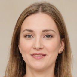 Joyful white young-adult female with long  brown hair and grey eyes