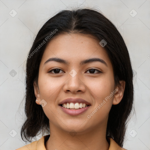 Joyful latino young-adult female with medium  brown hair and brown eyes