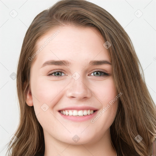 Joyful white young-adult female with long  brown hair and blue eyes