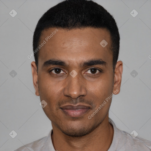 Joyful black young-adult male with short  black hair and brown eyes