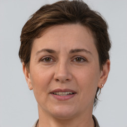 Joyful white adult female with short  brown hair and brown eyes