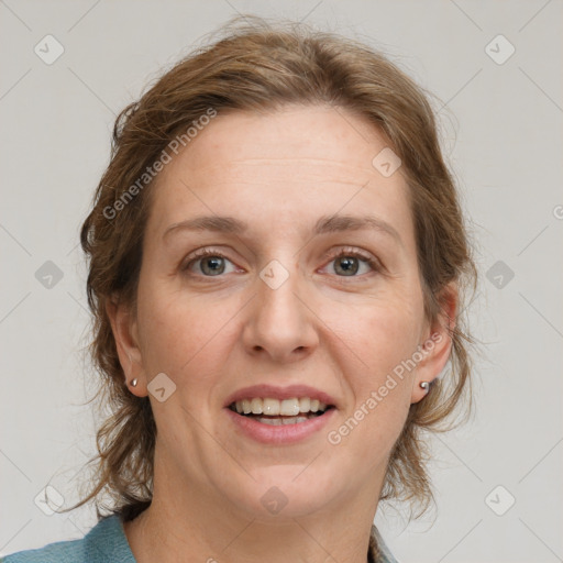 Joyful white adult female with medium  brown hair and grey eyes