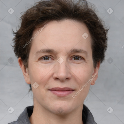 Joyful white adult female with short  brown hair and brown eyes