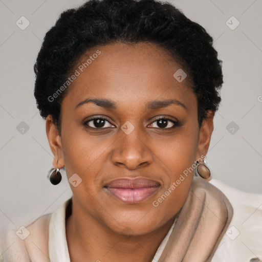 Joyful black young-adult female with short  brown hair and brown eyes
