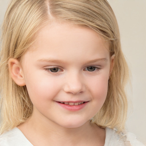 Joyful white child female with medium  blond hair and brown eyes