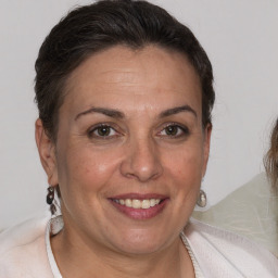 Joyful white adult female with short  brown hair and brown eyes