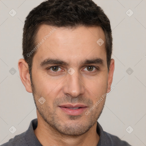 Joyful white adult male with short  brown hair and brown eyes