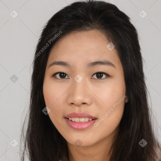 Joyful asian young-adult female with long  brown hair and brown eyes