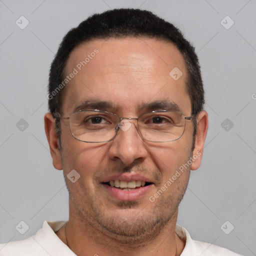 Joyful white adult male with short  brown hair and brown eyes