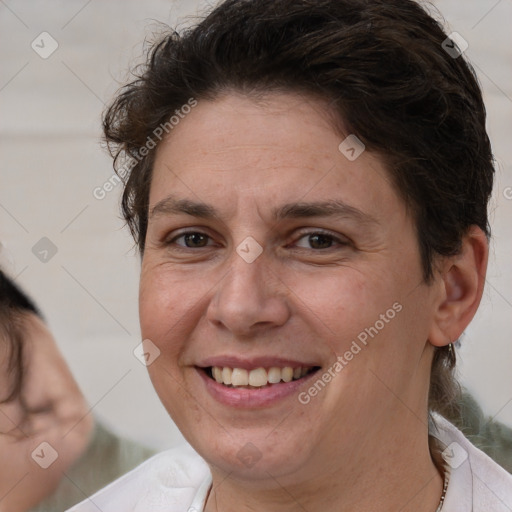 Joyful white adult female with short  brown hair and brown eyes