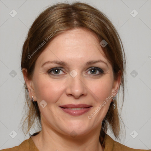 Joyful white adult female with medium  brown hair and grey eyes