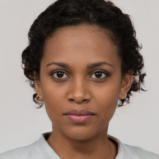 Neutral black young-adult female with short  brown hair and brown eyes