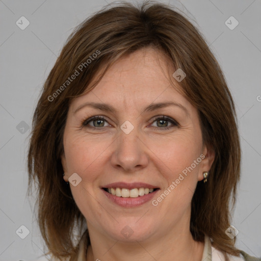 Joyful white adult female with medium  brown hair and grey eyes