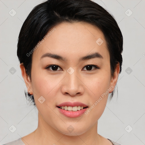 Joyful asian young-adult female with medium  black hair and brown eyes