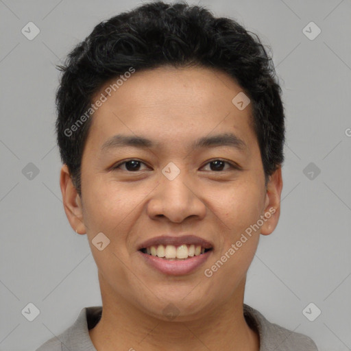 Joyful latino young-adult male with short  brown hair and brown eyes