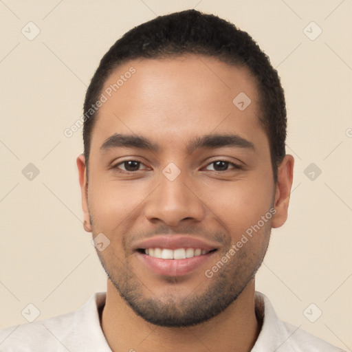 Joyful latino young-adult male with short  brown hair and brown eyes