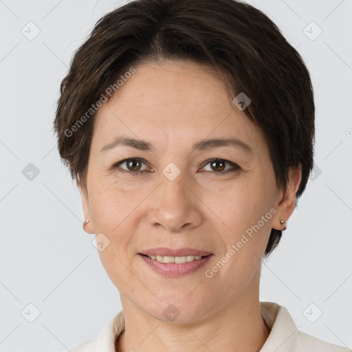 Joyful white adult female with short  brown hair and brown eyes