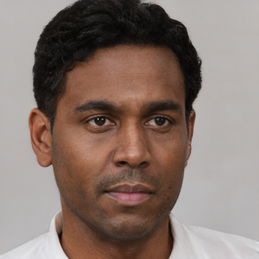 Neutral black young-adult male with short  black hair and brown eyes