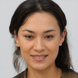 Joyful asian young-adult female with medium  brown hair and brown eyes