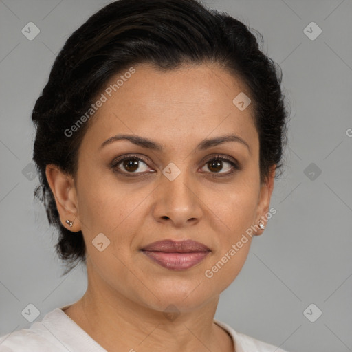 Joyful latino adult female with medium  brown hair and brown eyes