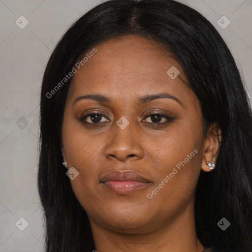 Joyful black adult female with long  black hair and brown eyes