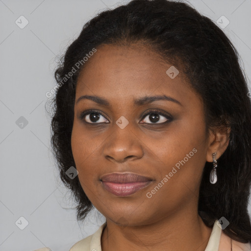 Joyful black young-adult female with long  brown hair and brown eyes