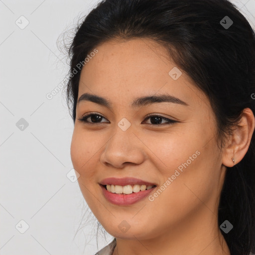 Joyful asian young-adult female with long  brown hair and brown eyes