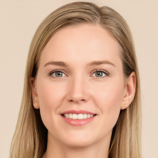 Joyful white young-adult female with long  brown hair and grey eyes