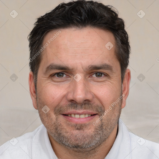 Joyful white adult male with short  brown hair and brown eyes