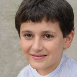 Joyful white child male with short  brown hair and brown eyes