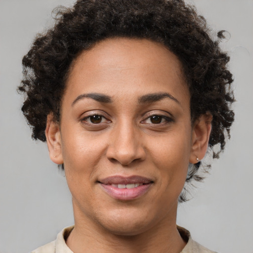 Joyful latino young-adult female with short  brown hair and brown eyes