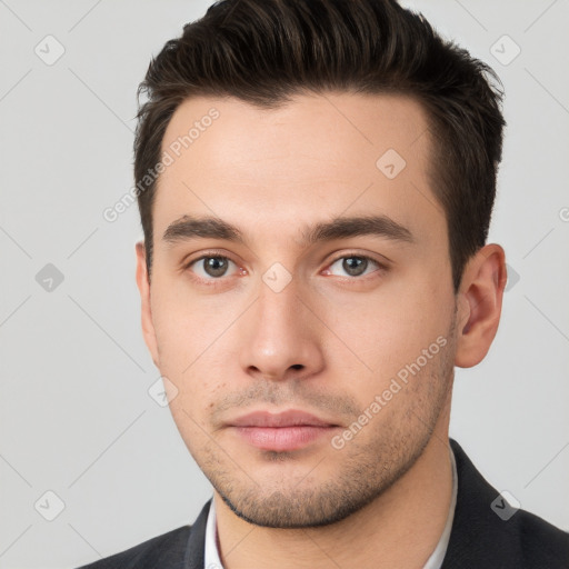 Neutral white young-adult male with short  brown hair and brown eyes