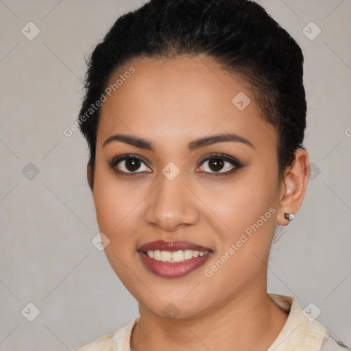 Joyful latino young-adult female with short  black hair and brown eyes