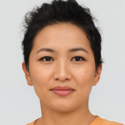 Joyful asian young-adult female with short  brown hair and brown eyes