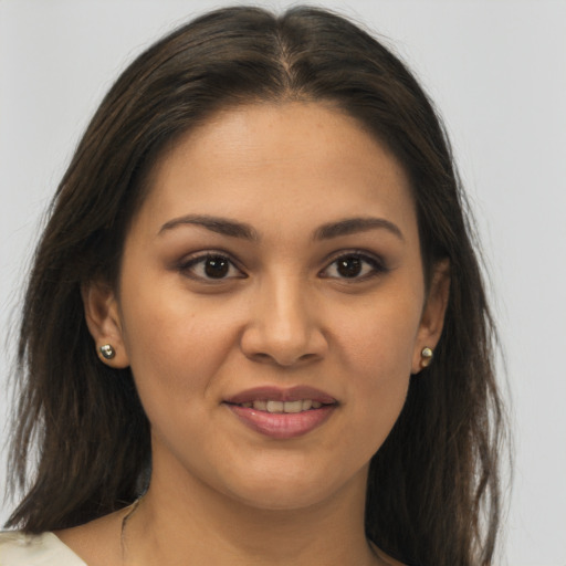 Joyful white young-adult female with long  brown hair and brown eyes