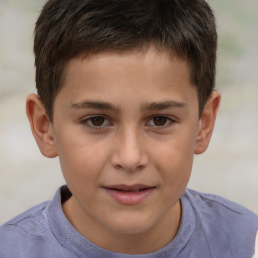 Joyful white child male with short  brown hair and brown eyes