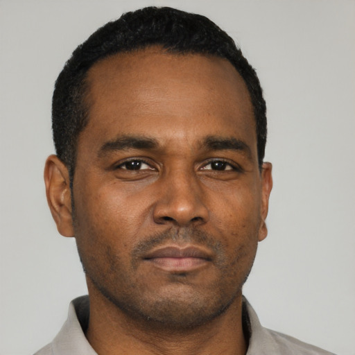 Neutral black young-adult male with short  black hair and brown eyes
