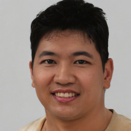 Joyful asian young-adult male with short  black hair and brown eyes