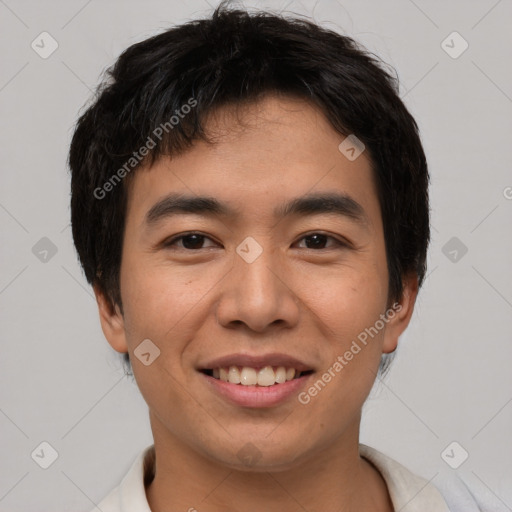 Joyful asian young-adult male with short  black hair and brown eyes