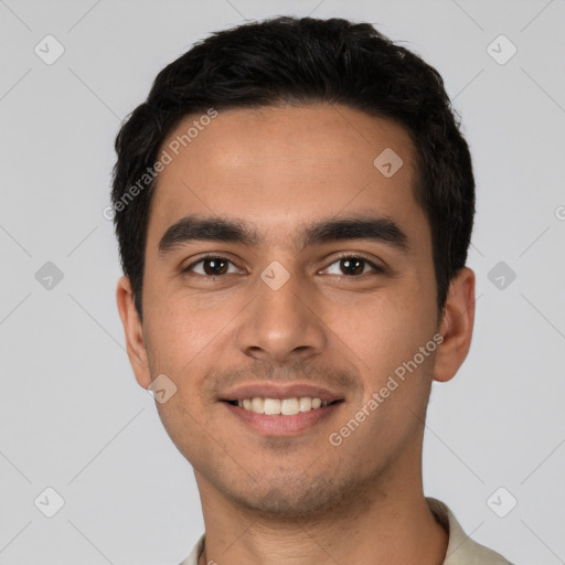 Joyful white young-adult male with short  black hair and brown eyes