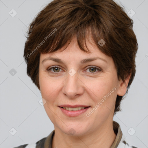 Joyful white adult female with medium  brown hair and grey eyes