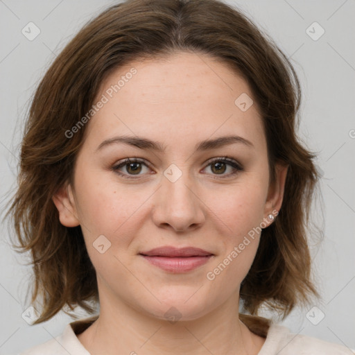 Joyful white young-adult female with medium  brown hair and green eyes