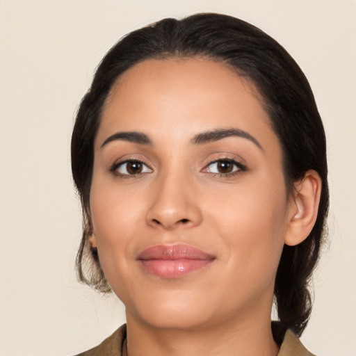 Joyful latino young-adult female with medium  black hair and brown eyes