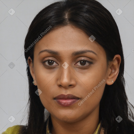 Joyful black young-adult female with long  black hair and brown eyes