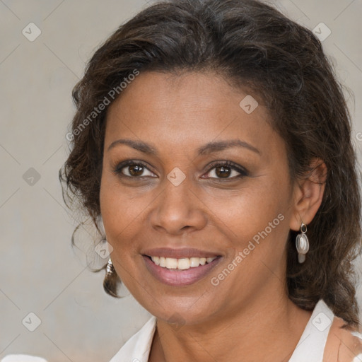 Joyful black adult female with medium  brown hair and brown eyes