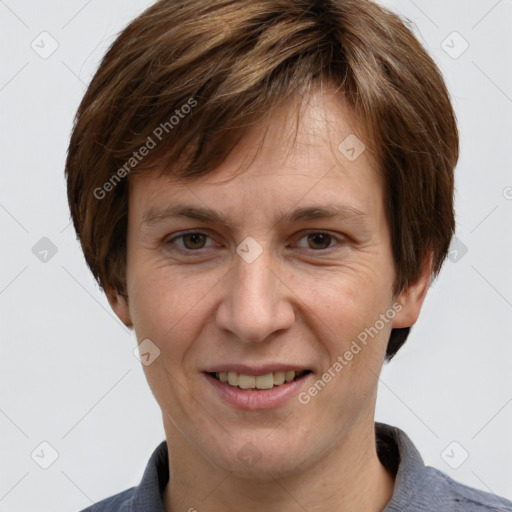 Joyful white adult male with short  brown hair and grey eyes