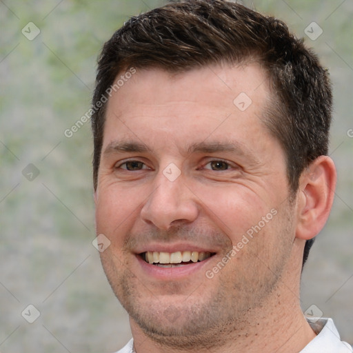 Joyful white adult male with short  brown hair and brown eyes