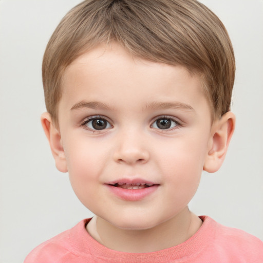 Joyful white child male with short  brown hair and grey eyes