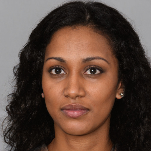 Neutral latino young-adult female with long  black hair and brown eyes